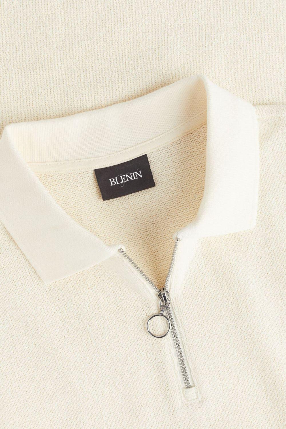 Moderne gebreide polo met rits